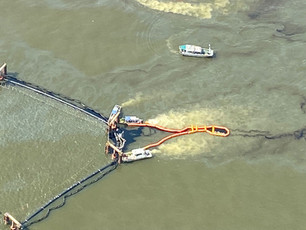 Pollution response teams mitigate oil discharge