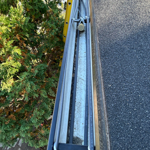 Close-up of an internal gutter heat trace system for commercial property protection.