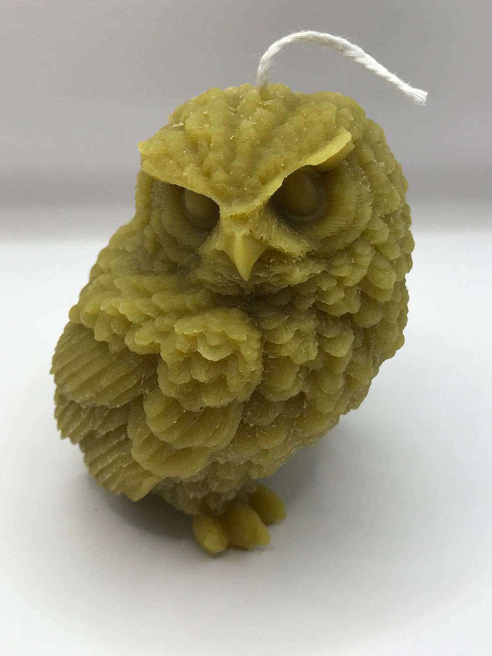 Thumbnail: Intricately sculpted beeswax owl candle