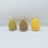 Thumbnail: Three pine cone-shaped candles in yellow, brown, and green