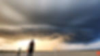 Person stands on a beach beside a tripod under a dramatic storm cloud and sunset sky; red Subscribe icon at bottom right.