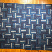 "Maddox" Large rectangular quilt with interlocking stripes made up of different shades of blue