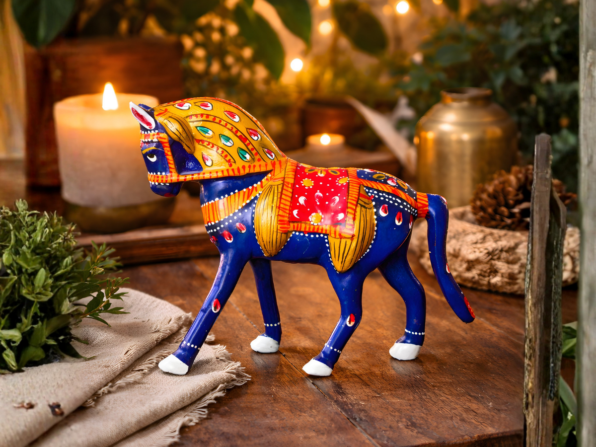 Handpainted blue metal horse figurine with vibrant saddle, traditional Indian handicraft decor piece for home gifting