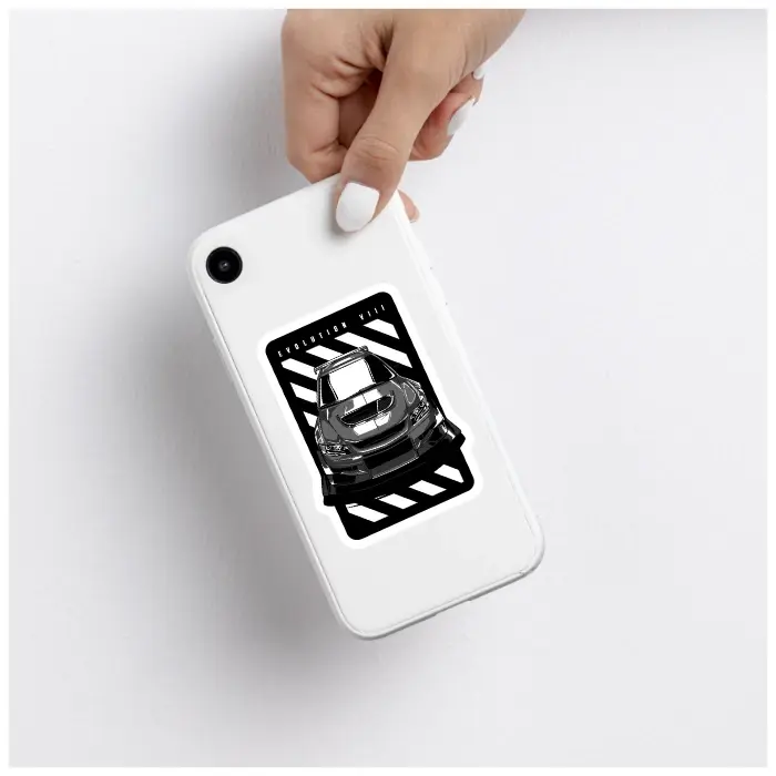 A silver laptop with a Mitsubishi Evolution VIII decal applied to the bottom-right palm rest.