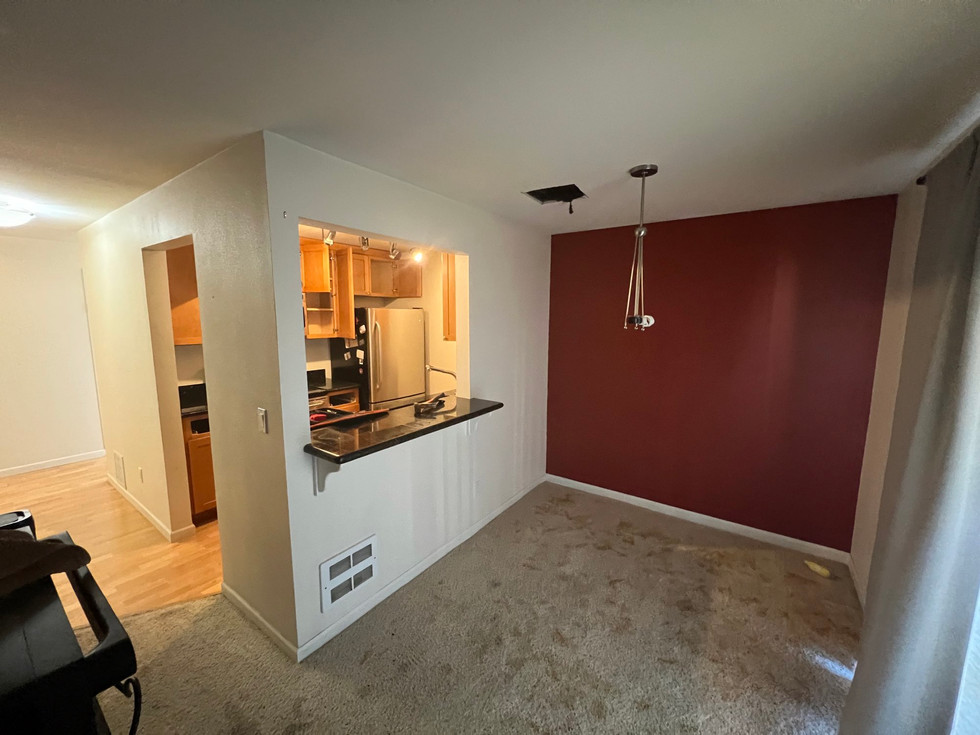 Hall style kitchen and empty dinning room