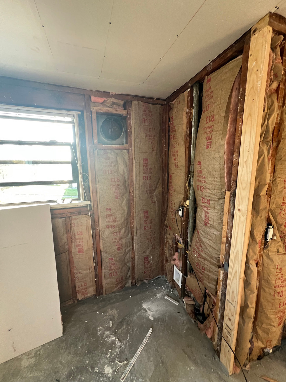 a room with r13 insulation on the walls