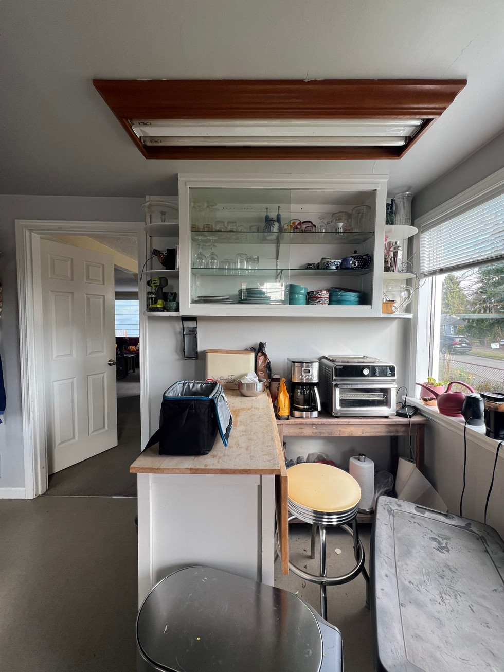 a kitchen with a toaster oven and a coffee maker
