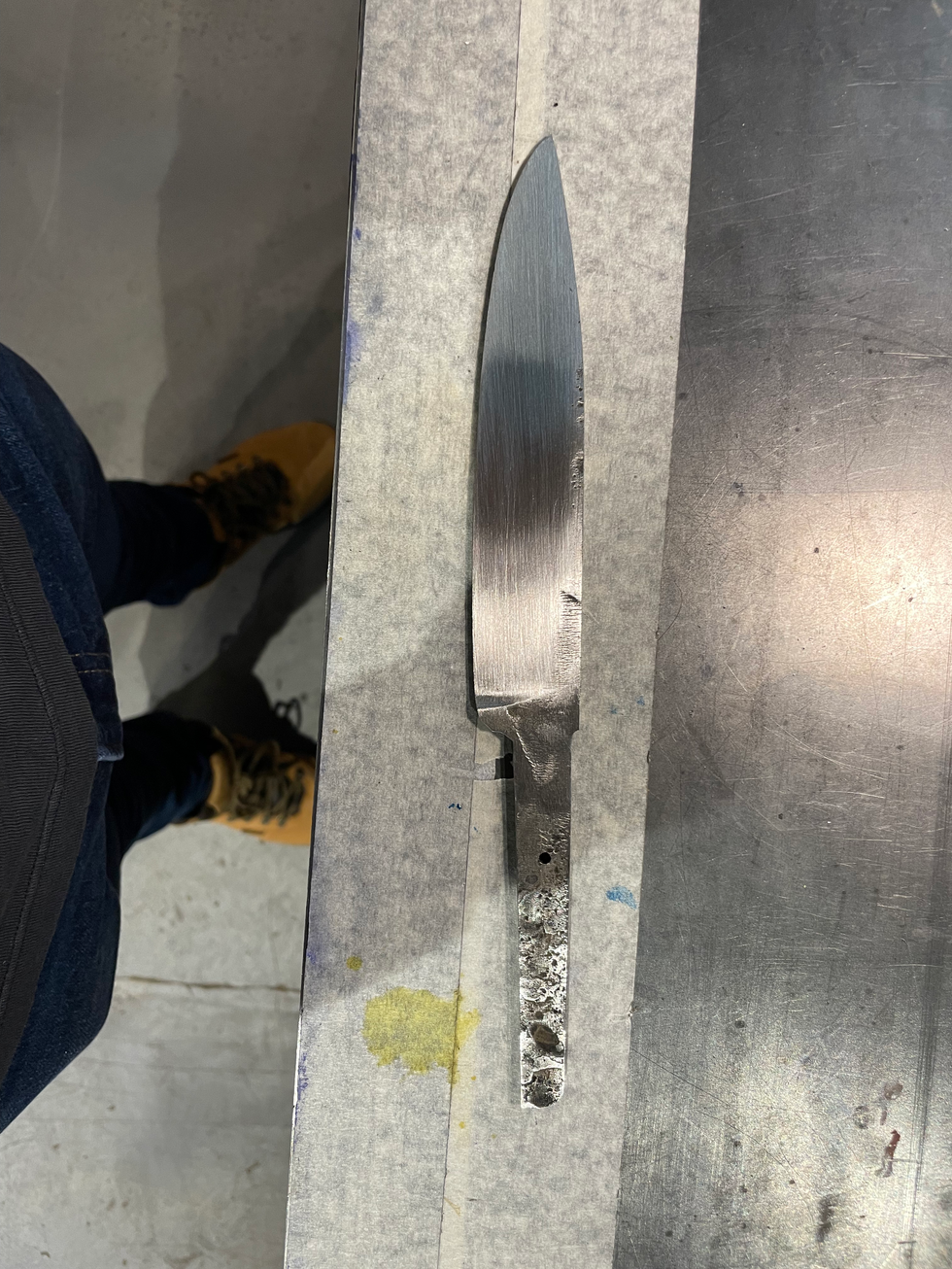 After grinding down the tang to turn it into a hidden tang blade.