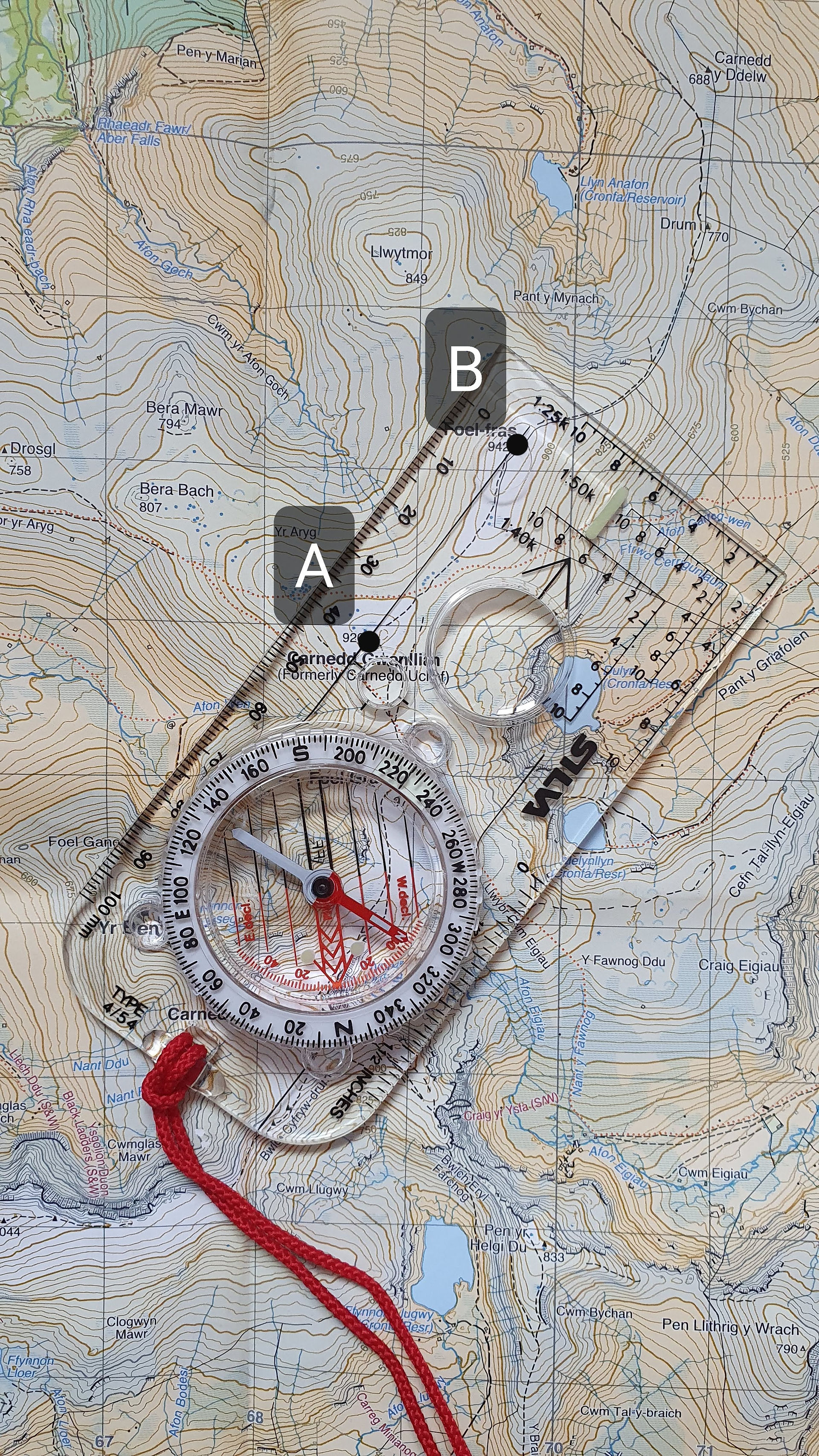 Lining up 2 points to take a compass bearing