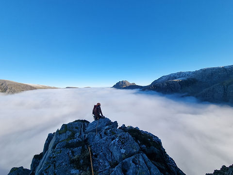 Scrambling on the East Ridge of Y Garn with a cloud inversion below