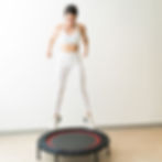 Woman jumping on mini trampoline