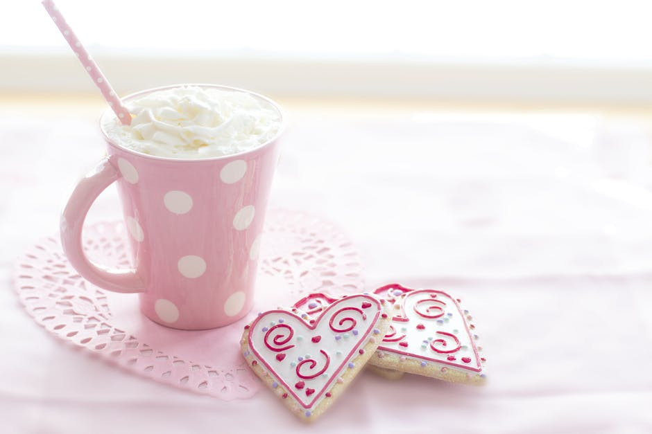 Pink and White Ceramic Mug on Table