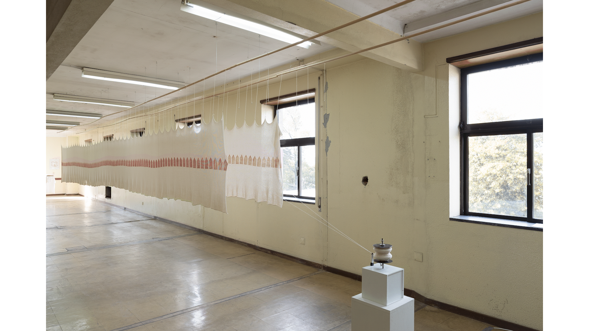 When Ends Meet — kinetic fiber installation, woven textile unraveling with motorized mechanism, Angeles Jacobi