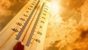 Thermometer on a hot sky background