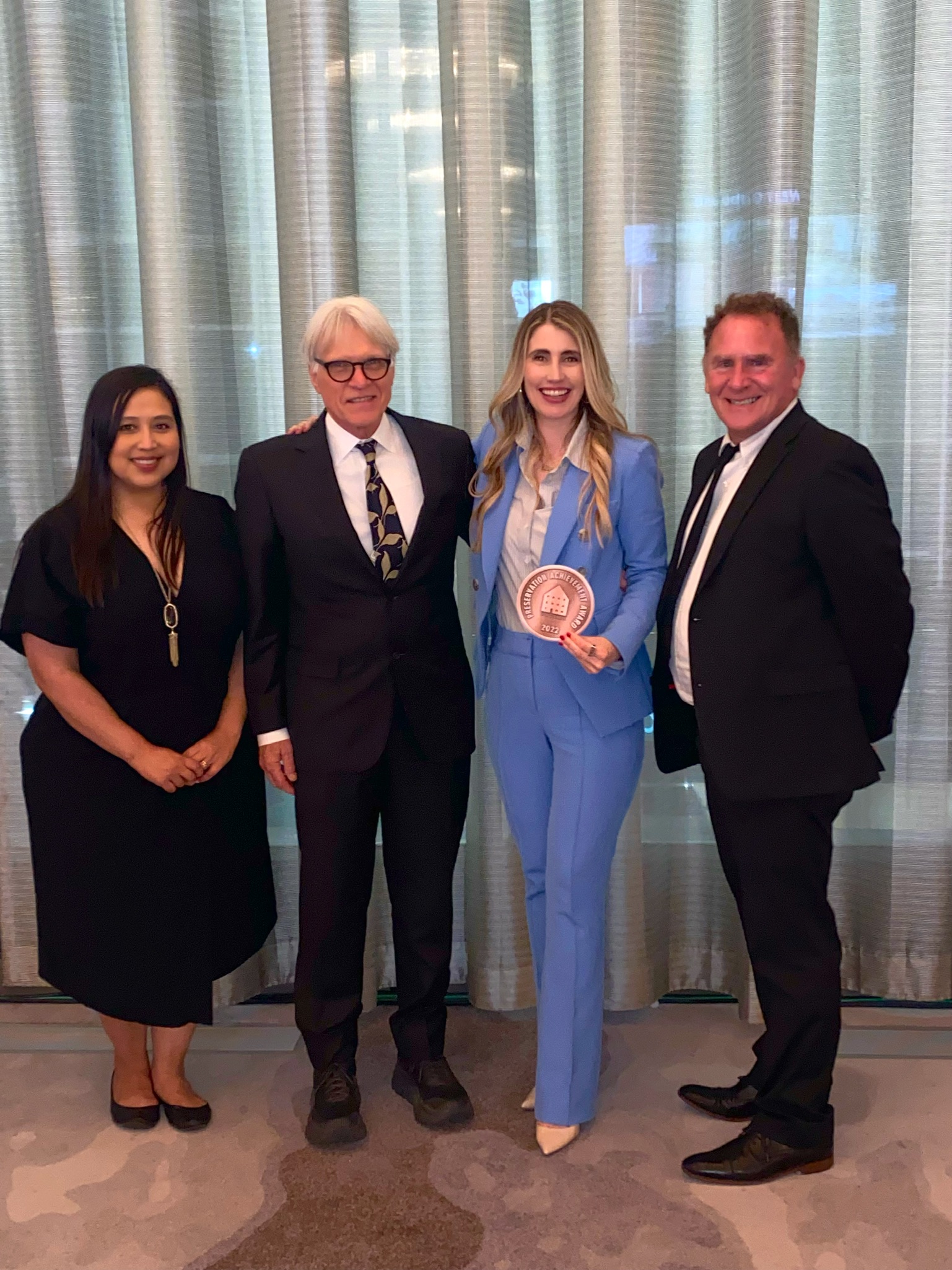Tanya Ragan accepting the 2022 Preservation Dallas Achievement Award for the Purse Building