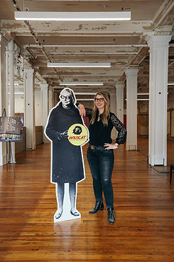 Tanya Ragan standing with a Jane Jacobs Cutout in the Purse Building, a Wildcat Management Redevelopment Project.