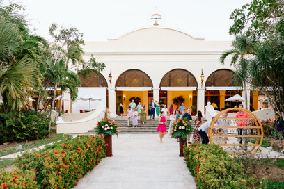 Guests arriving to open-air reception courtyard at Valentin Imperial Riviera Maya destination wedding