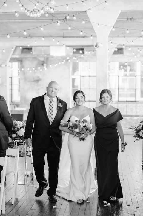 Black and White Photo of bride walking down the aisle at The Bride and Bauer Venue