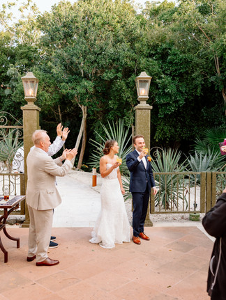 Bride and groom greeting guests during cocktail hour at Riviera Maya destination wedding