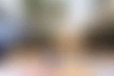 Couple sharing first dance under string lights and palm trees at Mexico destination wedding