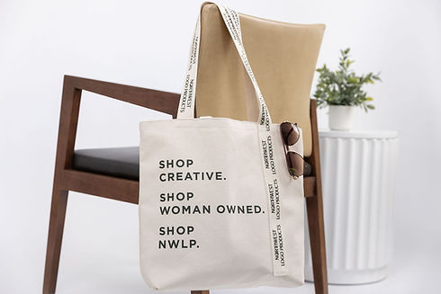 Brown chair with tote back and sunglasses branded merch