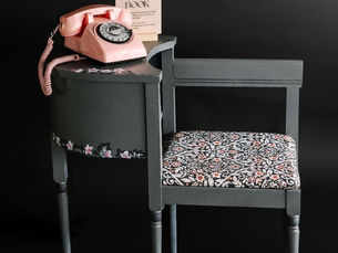Dark setting features a vintage pink rotary phone on a gray floral-patterned chair with "Audio Guest Book" text. Elegant and nostalgic.