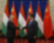 BEIJING, CHINA - FEBRUARY 13: (L-R) Hungary Prime Minister Viktor Orban and Chinese President Xi Jinping shake hands before a meeting at the Great Hall of the People on February 13, 2014 in Beijing, China. Orban is on an official visit to China and is expected to hold meetings with Chinese counterparts to boost ties between the two countries. (Photo by Rolex Dela Pena - Pool/Getty Images)