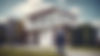 white middle aged 45-50 male Male Mortgage broker in front of a beautiful contemporary hou