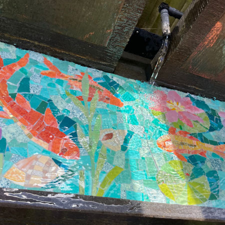 mosaic in glass smalti featuring goldfish, sea horses, lillies, sea plants and shells