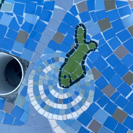 Topographic waterplay mosaic pond with fish and ripples mosaic inspired by kids' drawings