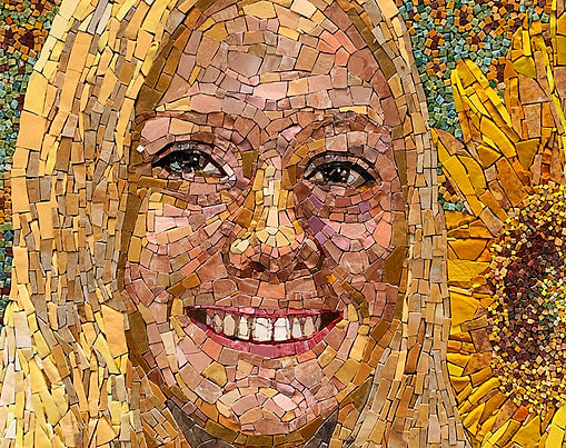 Close up of mosaic portrait of girl's face with sunflower in the background