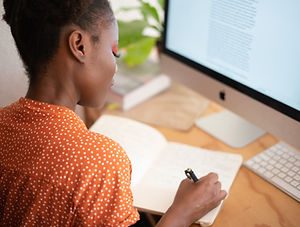 woman-writing-on-her-notebook-3059747.jp