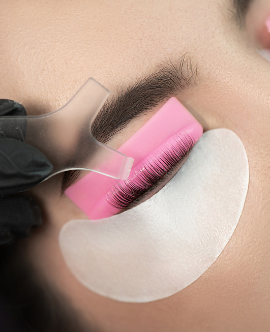 Master glues eyelashes to lash roller by applicator. Eyelash Care Treatment_ eyelash lifti