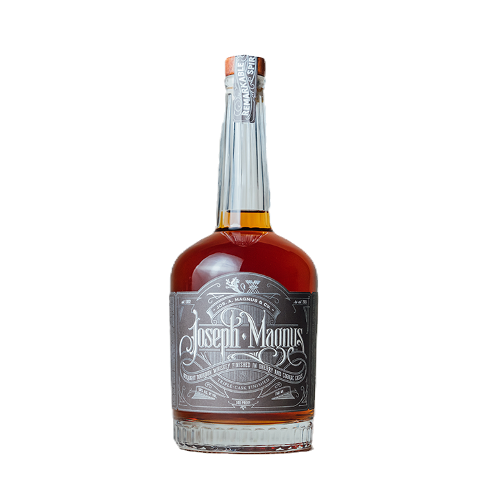 Bottle of Joseph Magnus whiskey with ornate label, amber liquid, and silver neck wrap.