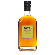 Brown bottle of Koval Single Barrel Bourbon Whiskey on white background. Label text includes "Koval," "Distilled in Chicago," and "47% Alc."