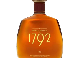 A bottle of 1792 Small Batch bourbon whiskey, with a golden hue and simple design, labeled prominently with "1792" on the front.