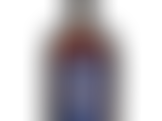 Bottle of BRBN Canadian bourbon-style whisky with blue label and amber liquid.