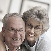 Older M-F couple with glasses