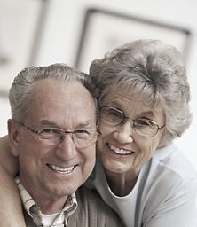 Older M-F couple with glasses