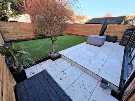 Porcelain patio, artificial grass , slatted fencing in Cheshire Altrincham