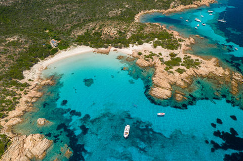 A secluded view of the Pink Beach on Budelli Island, known for its unique rosy sand and untouched beauty
