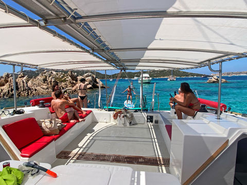 Guests relaxing in the shaded cockpit seating area