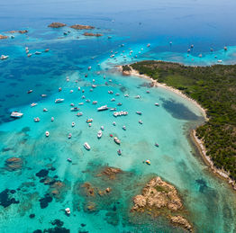 Cavaliere beachon Budelli Island overlooks the Manto della Madonna, a sea mirror with colors ranging from azure to emerald green