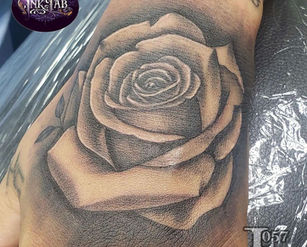 Rose on hand tattoo by Jey at Fine Ink East Colonial