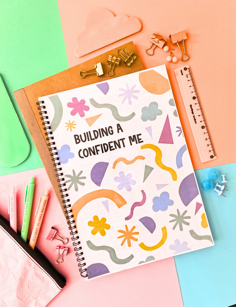 Notebook 'BUILDING A CONFIDENT ME', pens, ruler