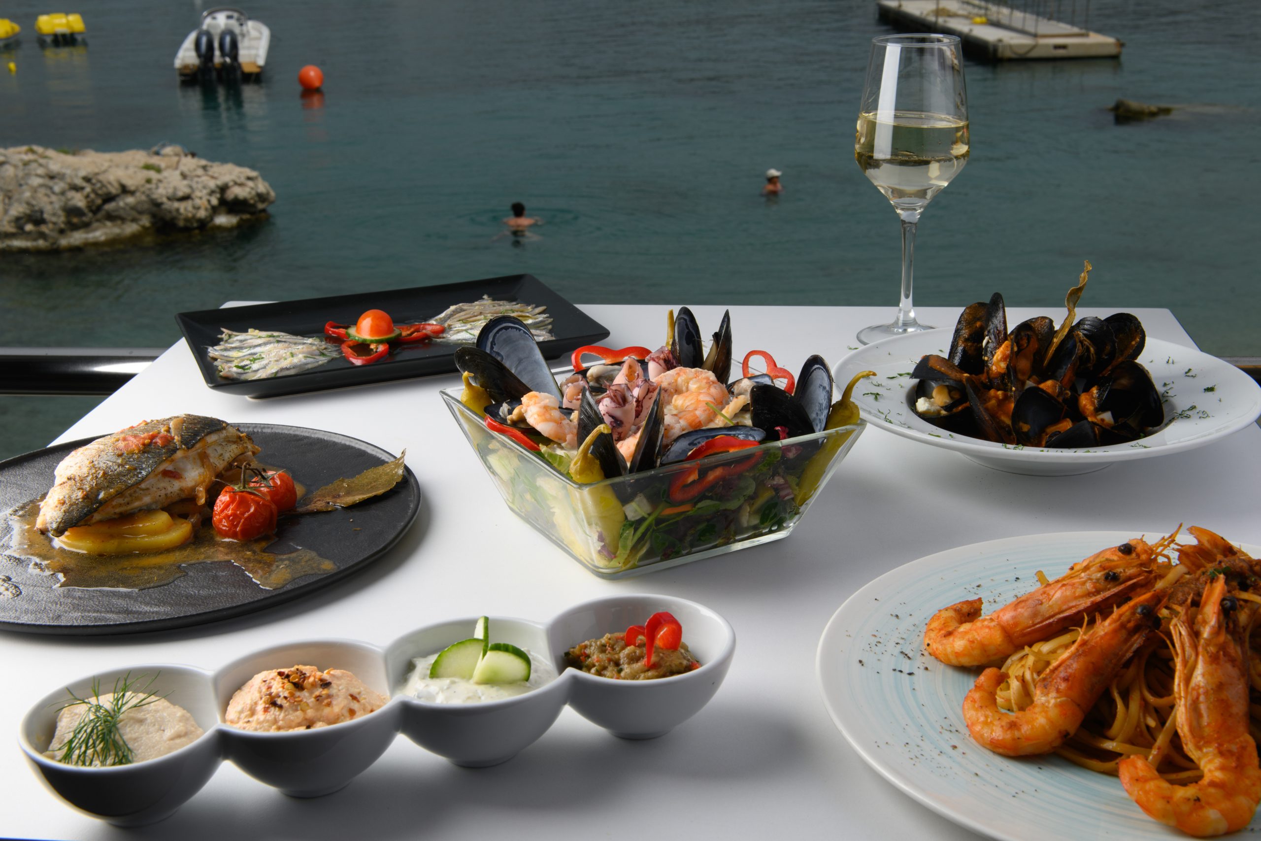 Seafood dishes overlooking the water at Alipa Restaurant in Paleokastritsa