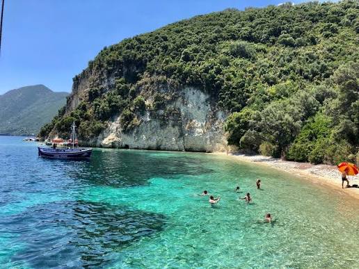 No regular sunbed or parasol service should be expected at this remote beach; bring your own shade and everything you need for the visit.