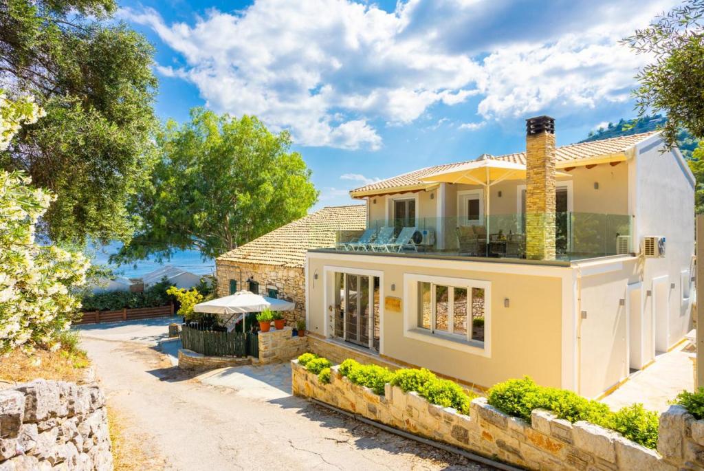 Villa Nikolakis exterior with upper terrace near Kerasia Beach, Corfu
