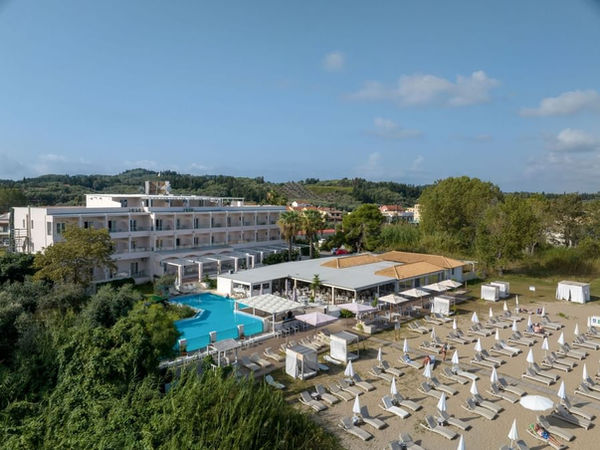 Aerial view of Cavomarina Beach hotel and beachfront in Kavos, Corfu