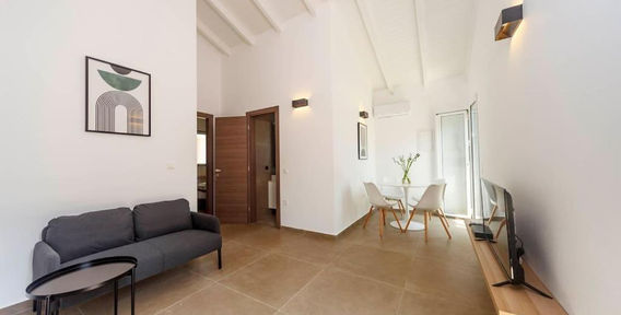 Open-plan living and dining area at Mary's Country House in Lefkimmi, Corfu